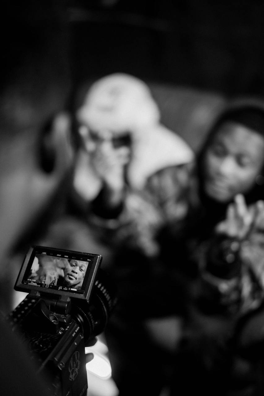 Camera monitor framing a shot on a DMY set